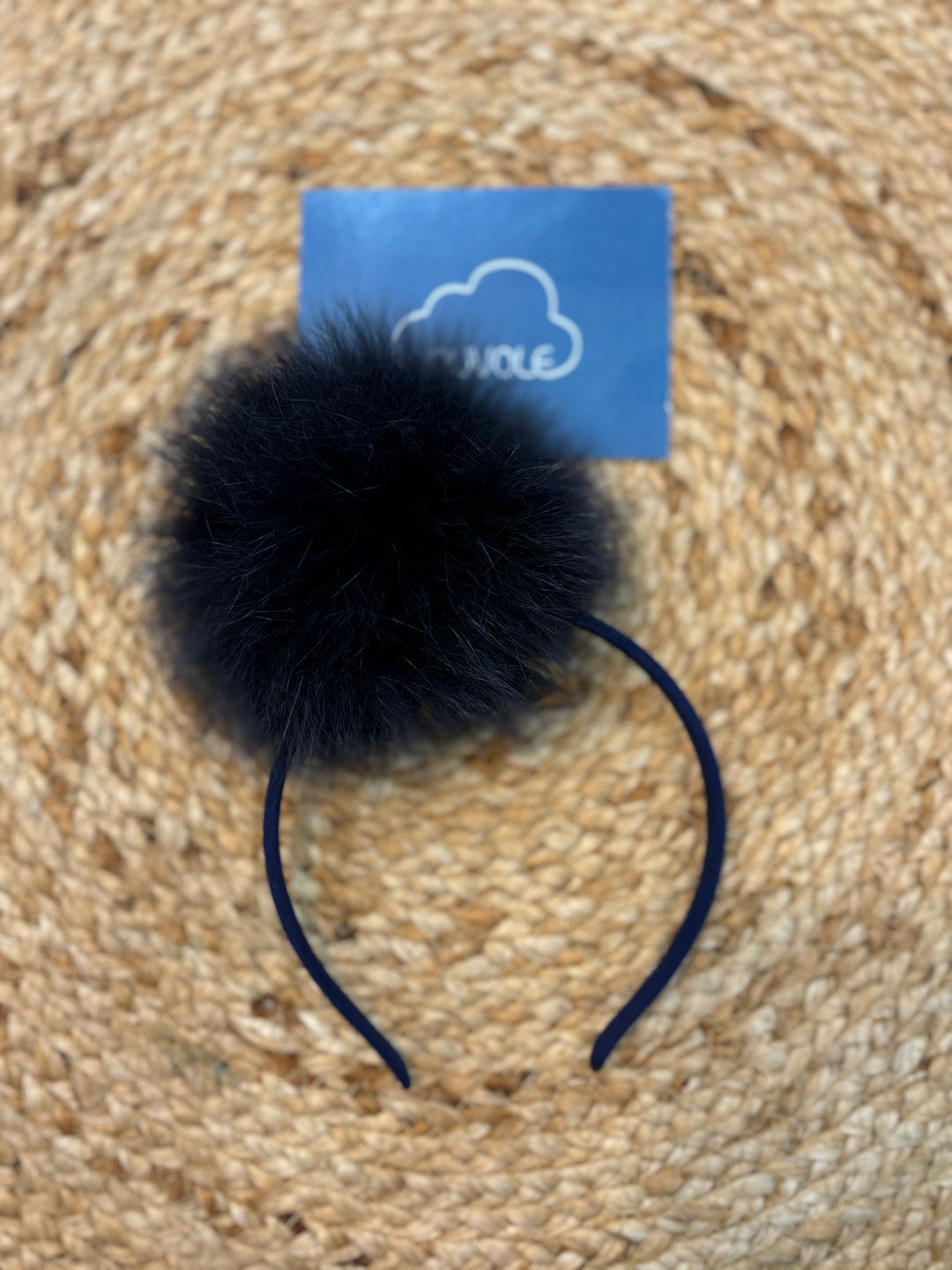 Cerchietto con pompon blu