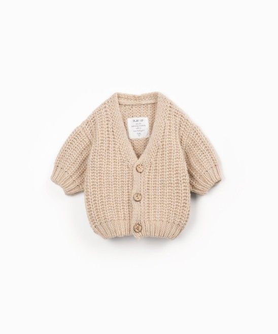 Cardigan over sabbia