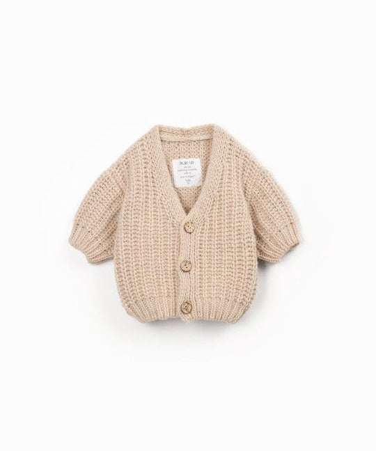Cardigan over sabbia