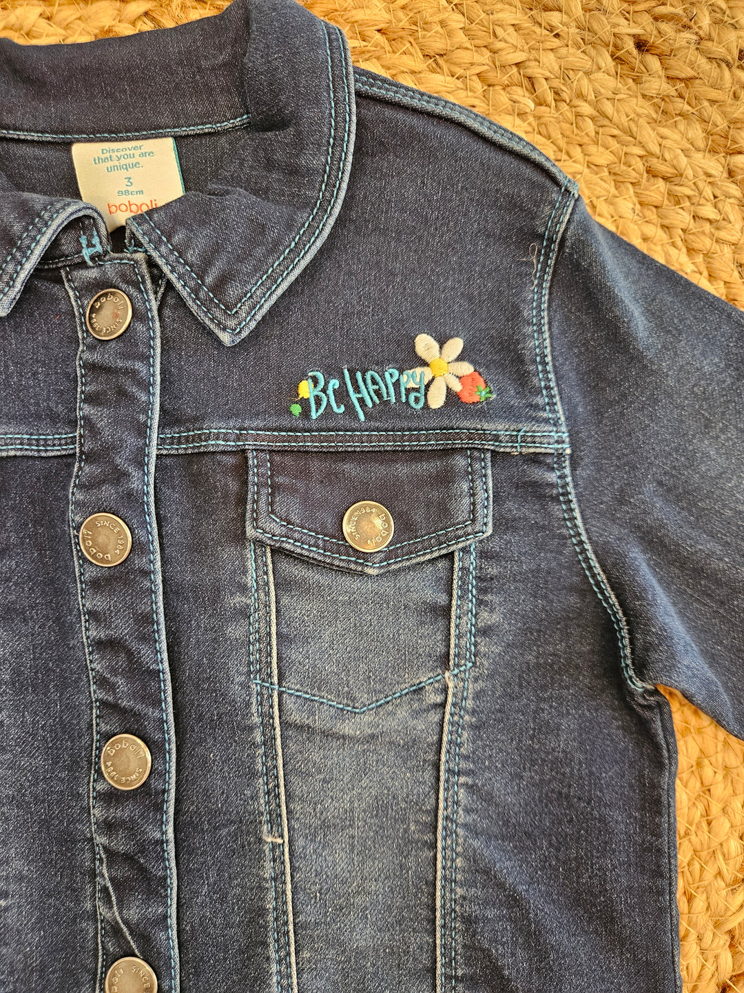 Giubbotto in denim scuro con decori