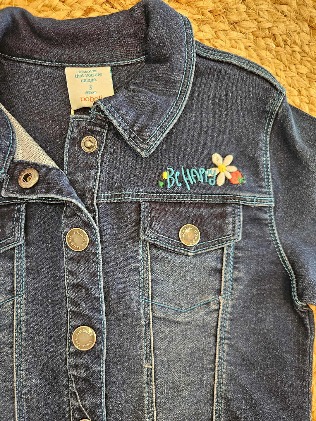 Giubbotto in denim scuro con decori